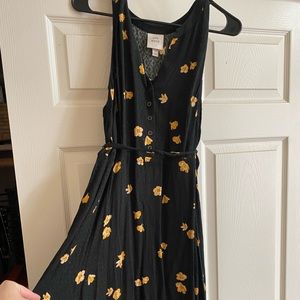 Large Knox Rose black dress with yellow flowers.